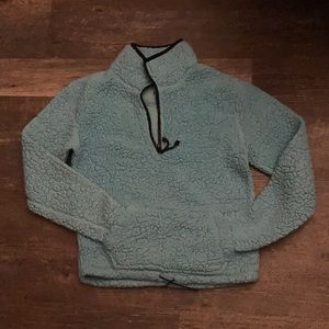 A jacket with a half way zip.